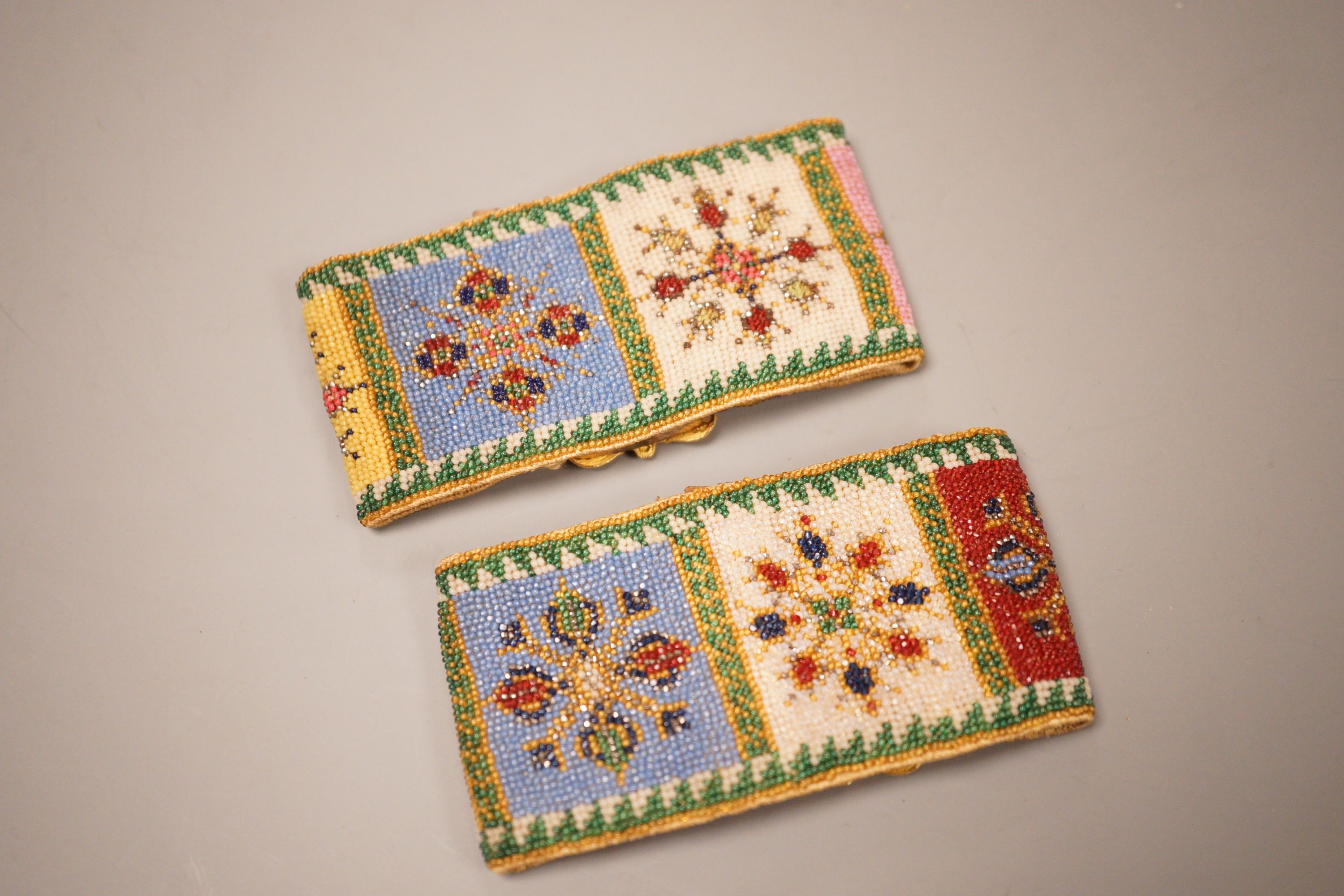 A pair of late Regency fine beadwork and ormolu bracelets
